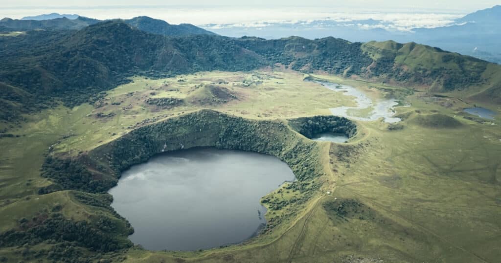 Aerial view of the crater of Mount Muanenguba and its twin lakes.