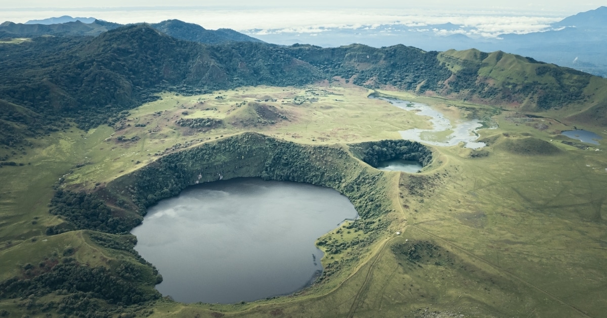 Aerial view of the crater of Mount Muanenguba and its twin lakes.
