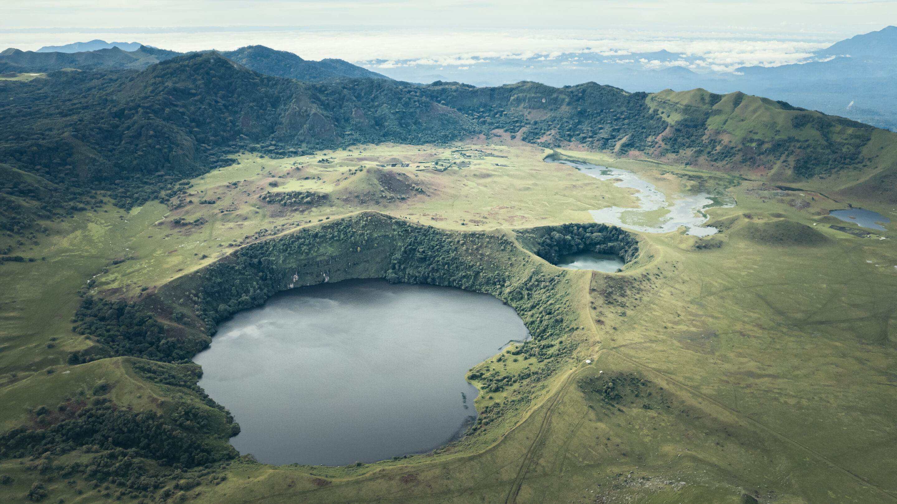 Aerial view of the crater of Mount Muanenguba and its twin lakes.