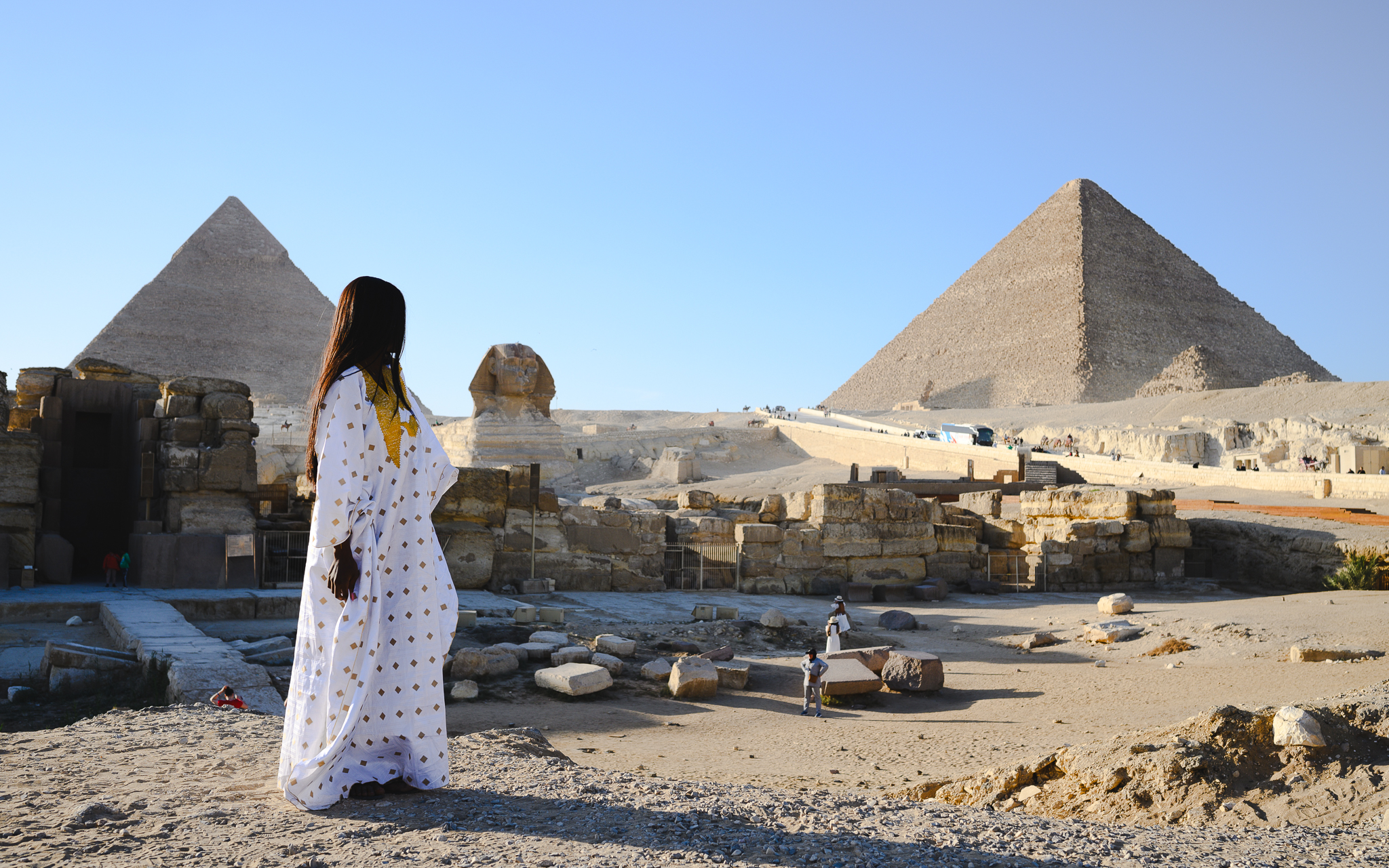 My wife with the Sphinx and Giza pyramids