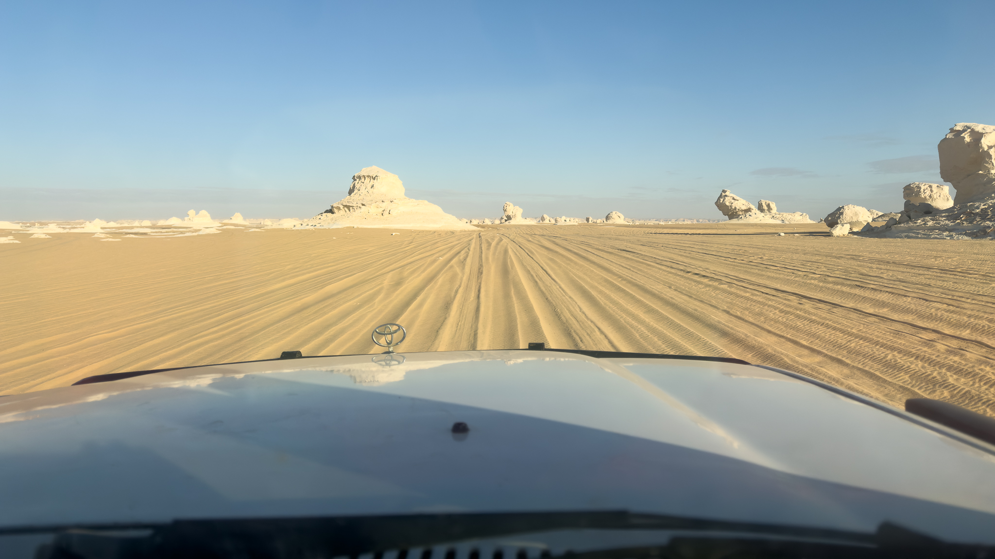 Driving from Bahariya Oasis in the white desert, a surreal landscape.