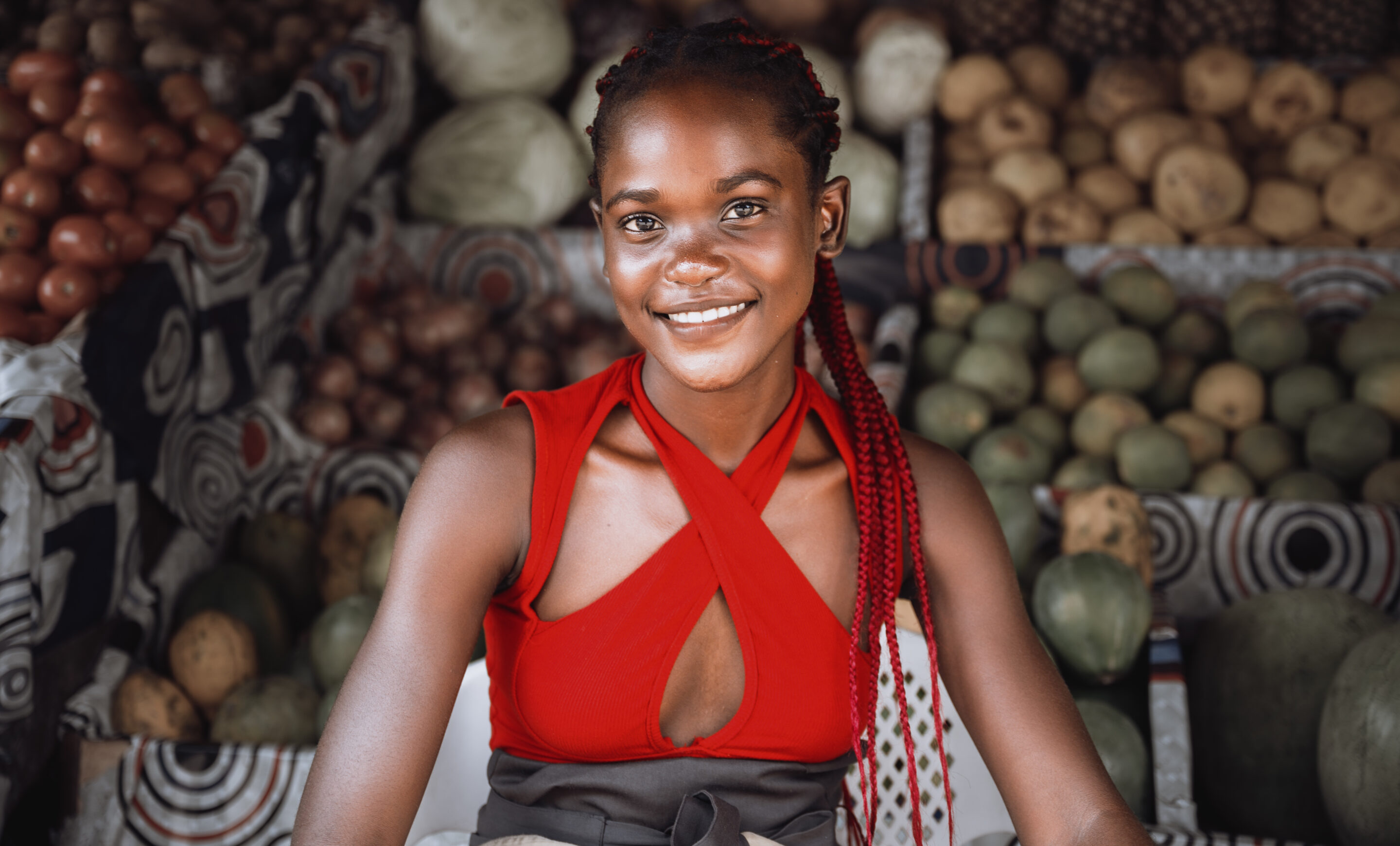 A young fruit seller smiling in Douala streets, Cameroon.